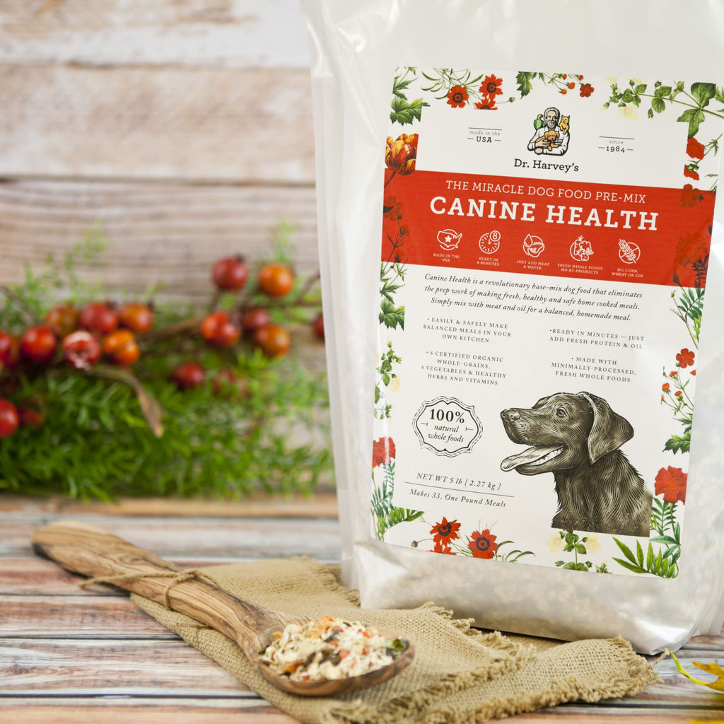 Dr. Harvey's Canine Health Miracle Dog Food Pre-Mix 5lb bag with wooden spoon of mix on burlap