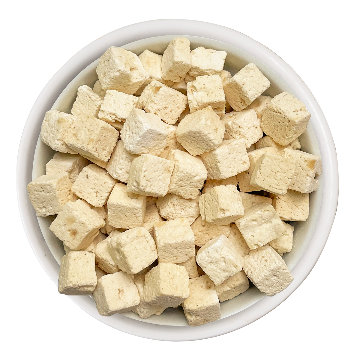 A white bowl filled with small, pale yellow cubes of Weruva Paw Lickin' Chicken Freeze Dried cat food, viewed from above on a white background.