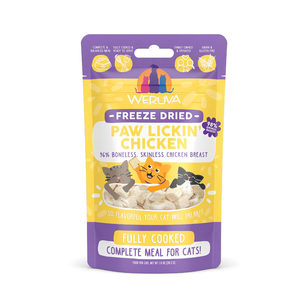 A purple and yellow bag of Weruva Paw Lickin’ Chicken Freeze Dried cat food features cartoon cats and chicken, is labeled gently cooked, 96% boneless chicken breast, and provides a complete meal for cats.
