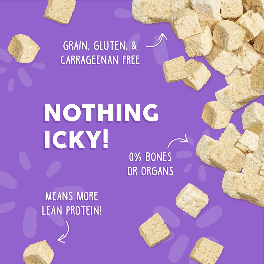 Beige, cube-shaped Weruva Paw Lickin’ Chicken Freeze Dried cat food pieces are scattered on a purple background with text: Nothing Icky!, grain, gluten & carrageenan free, 0% bones or organs, means more lean protein!.
