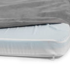 a close up of a Snooz with the outer cover unzipped, exposing the inner liner