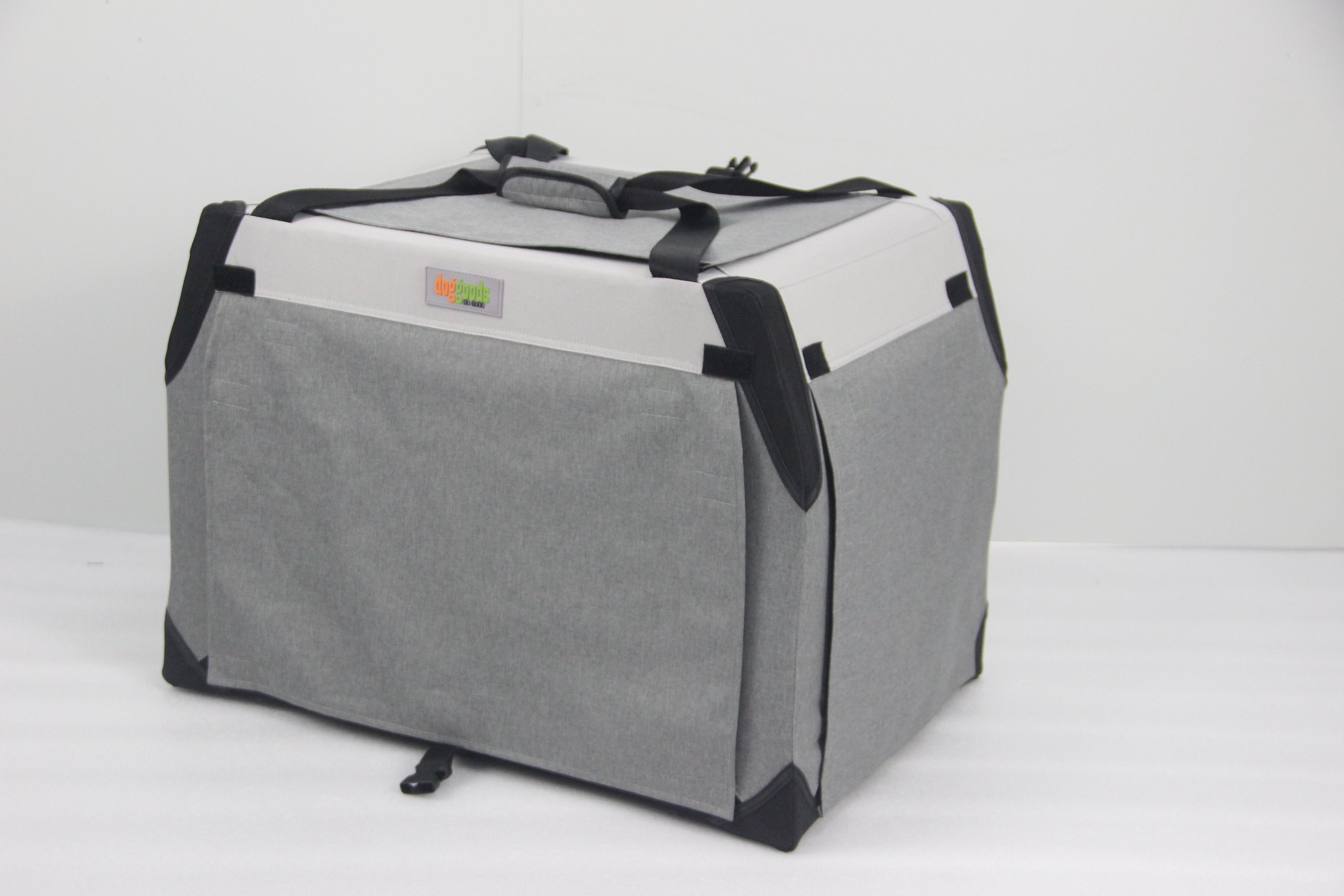 Foldable dog crate with roll-down blackout shades for privacy, sturdy handles for portability, and a durable design for travel or home use.