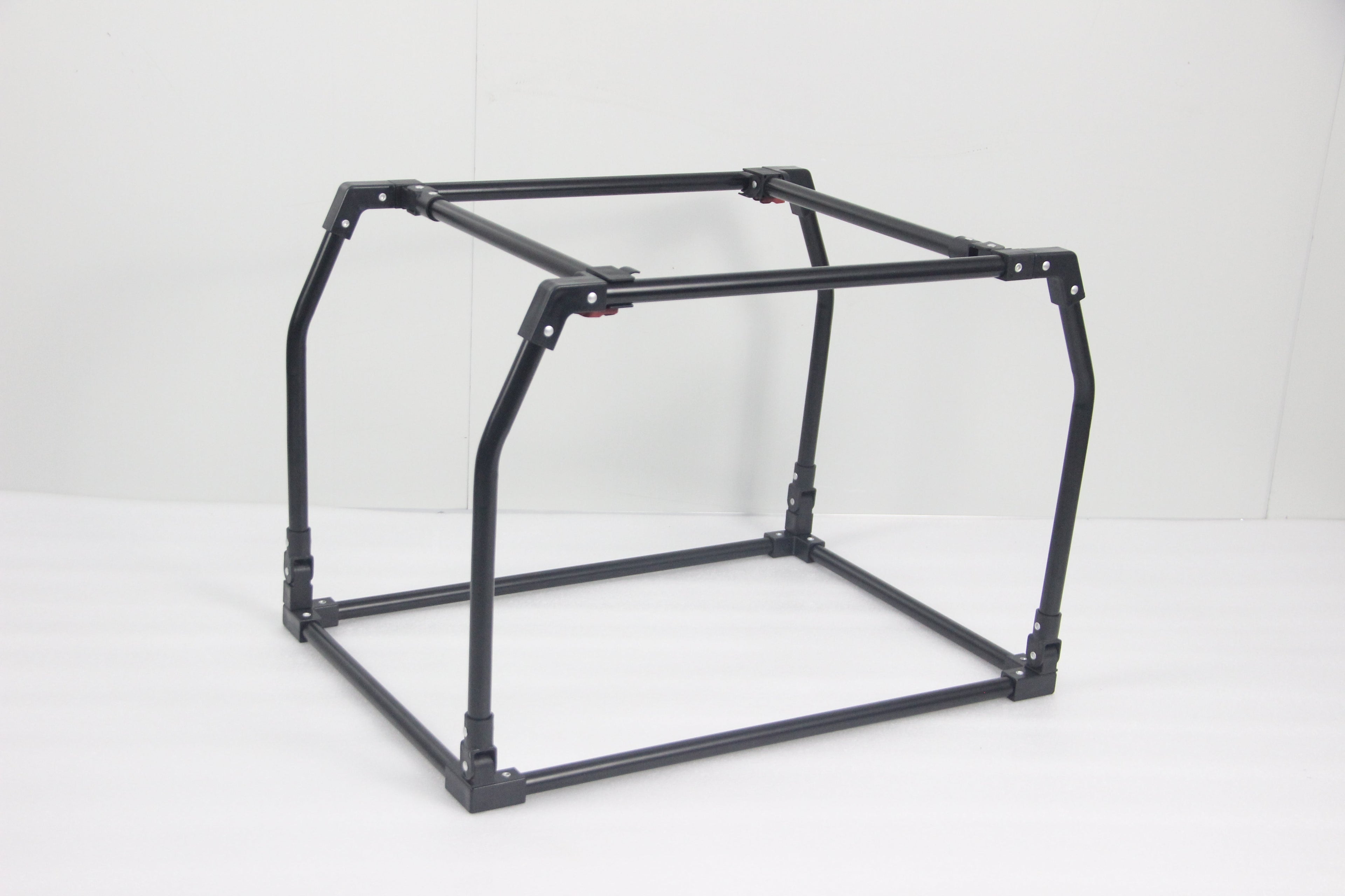 Sturdy black metal frame of the DogGoods foldable crate, designed for durability and easy assembly with a slide-and-click mechanism.