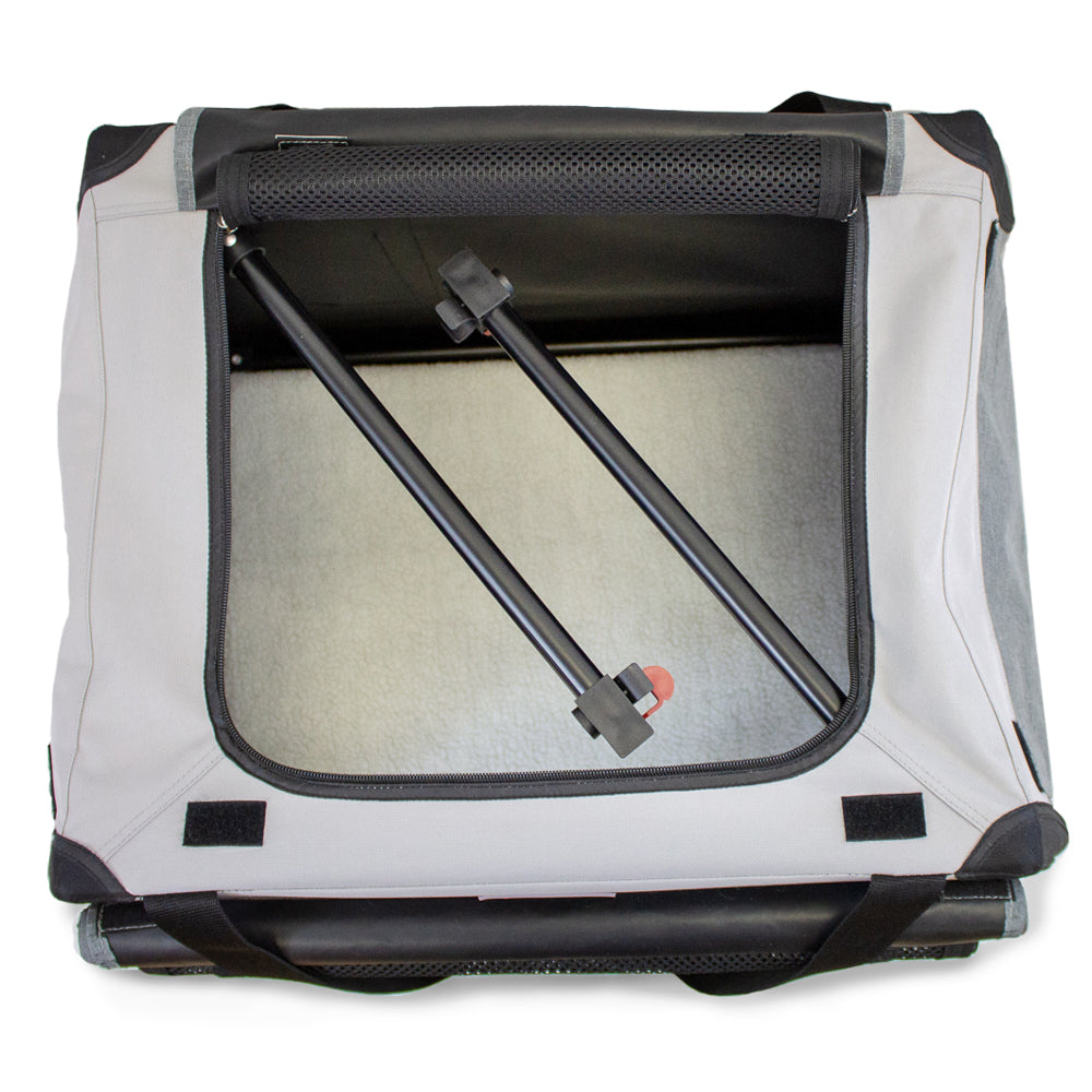 Top-down view of the DogGoods foldable crate showcasing the sturdy frame, breathable mesh, and soft fleece mat. Features a quick slide-and-click assembly mechanism.