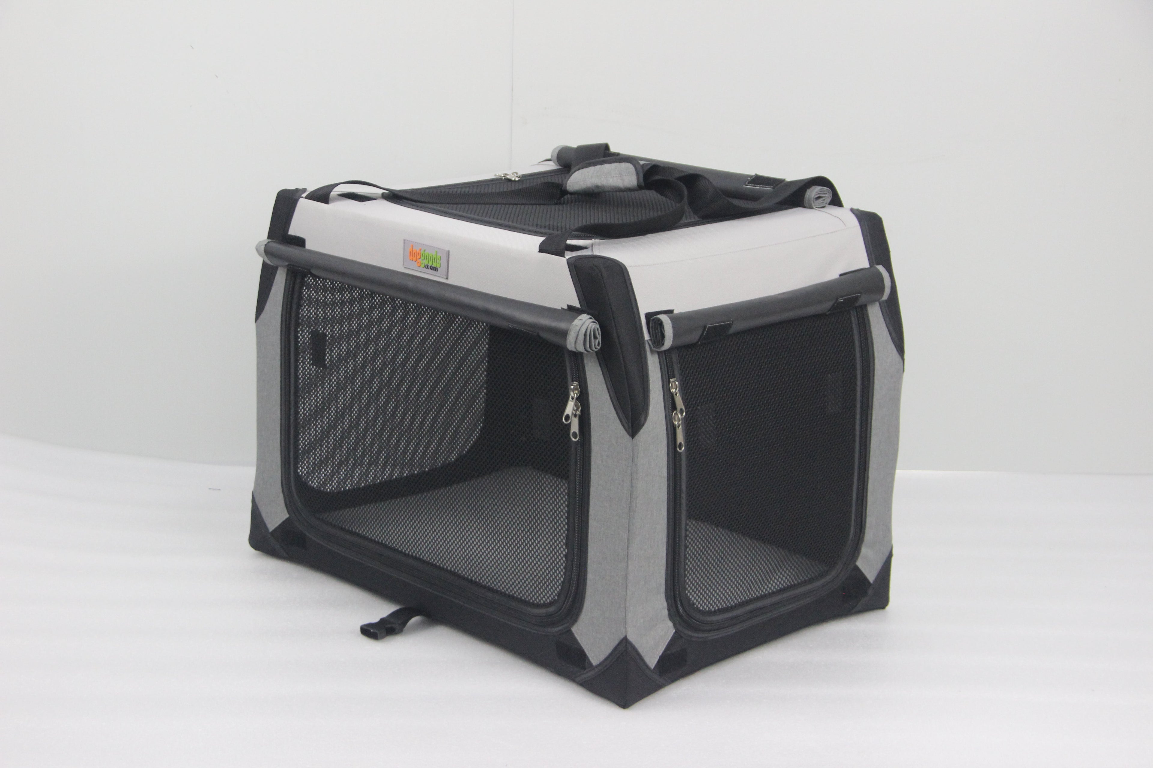 DogGoods foldable crate with zippered mesh sides for ventilation, roll-up blackout shades for privacy, and a sturdy, portable design for travel and home use.
