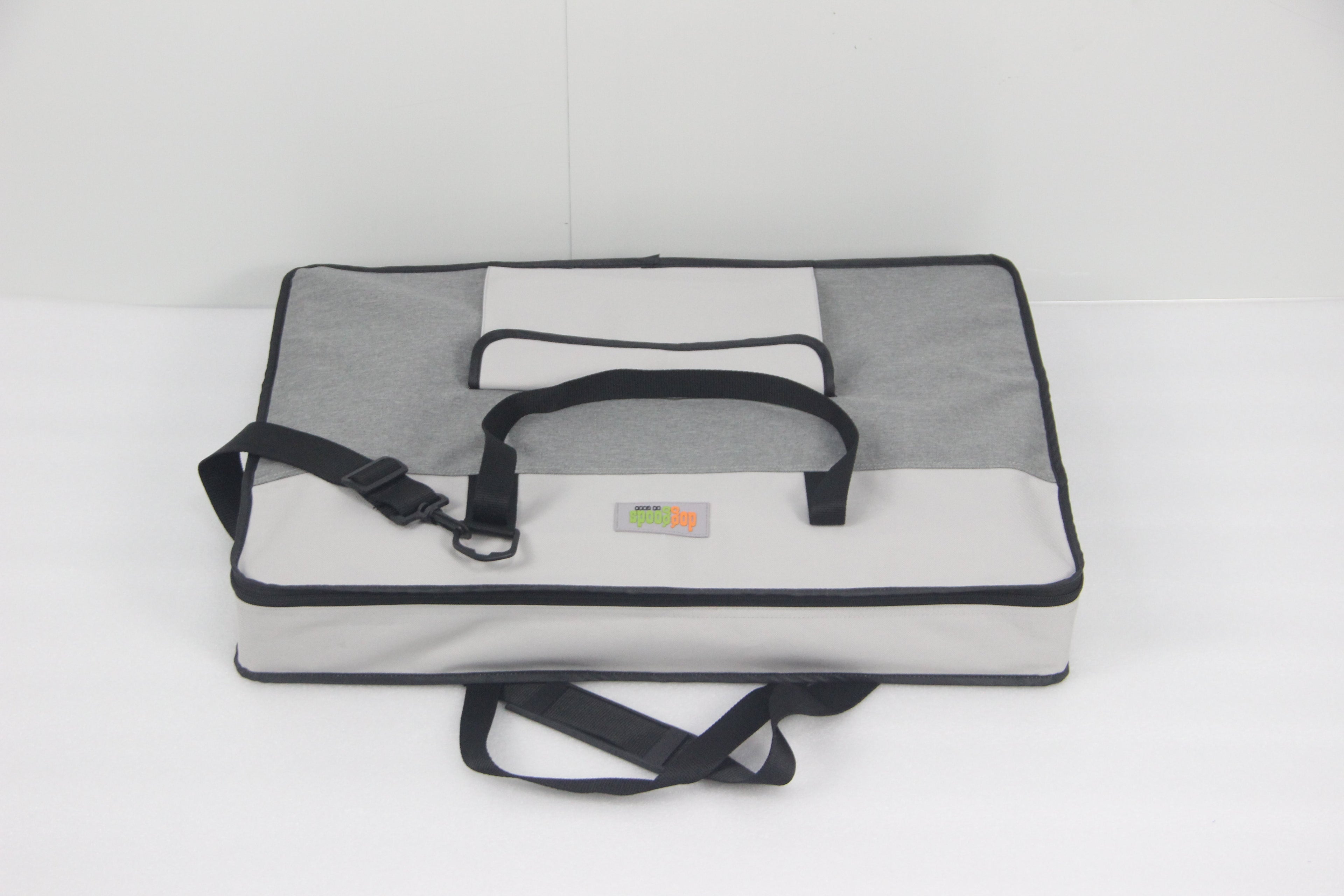 Compact and lightweight carrying case for the DogGoods foldable crate. Features sturdy handles and an adjustable shoulder strap for easy transport.