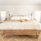 Labrador Retriever Dog resting on White Faux Fur Blanket