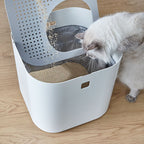 Modkat with lid open and cat looking down inside
