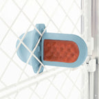 A royal blue Groov Training Aid attached to a white dog crate