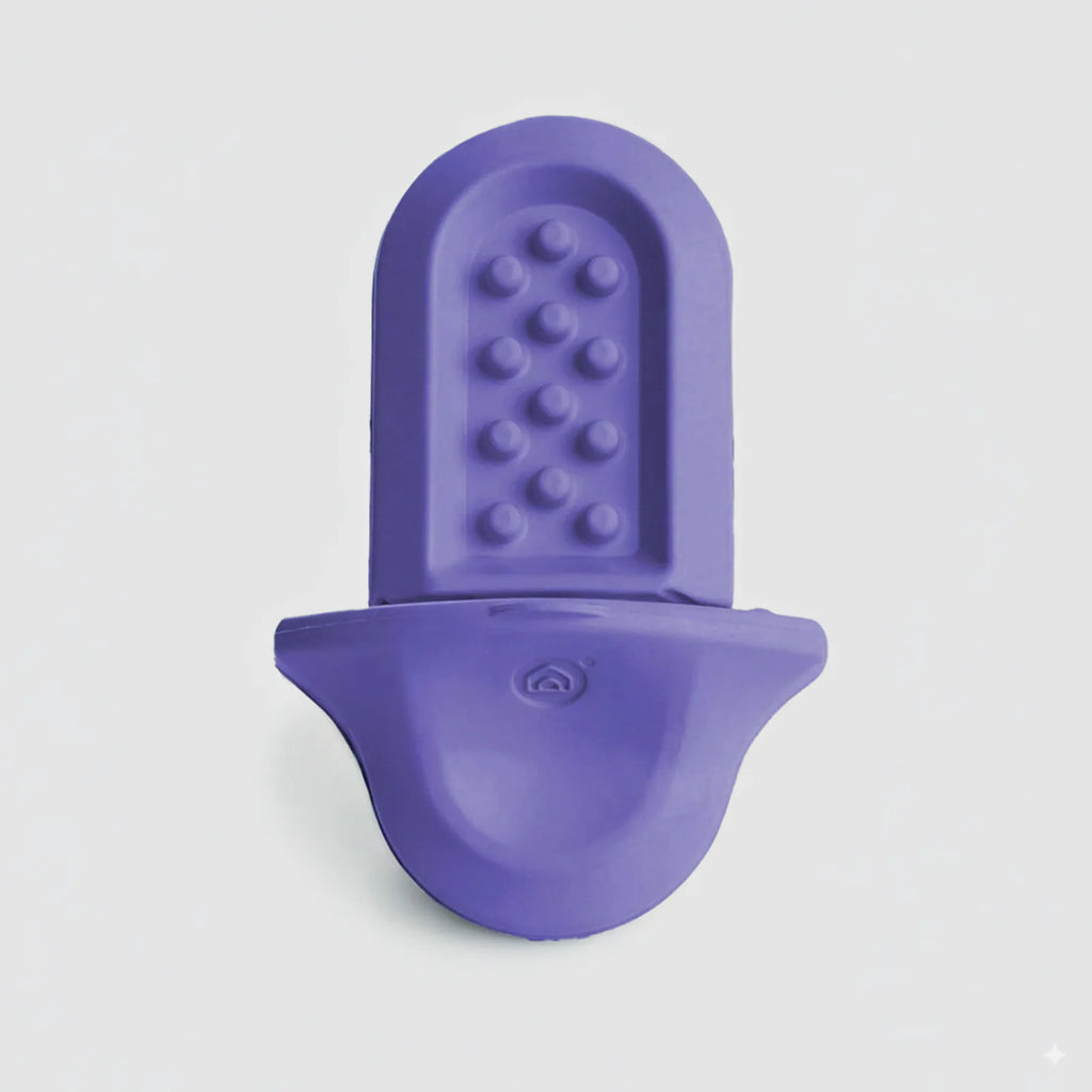 A lavender Groov training aid on a light grey background