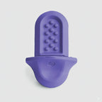 A lavender Groov training aid on a light grey background