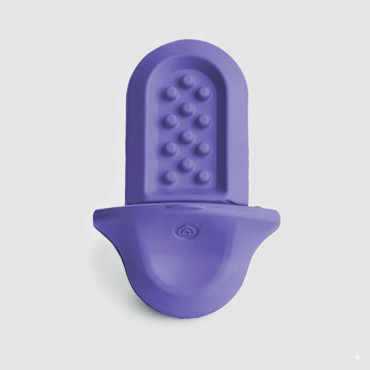 A lavender Groov training aid on a light grey background