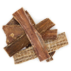 A pile of brown pieces of wood resembling Best Bully Sticks 5-6 Inch Beef Jerky Gullet Strips dog treats.