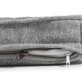 a close up of a grey snooz pad with the outer cover partially unzipped
