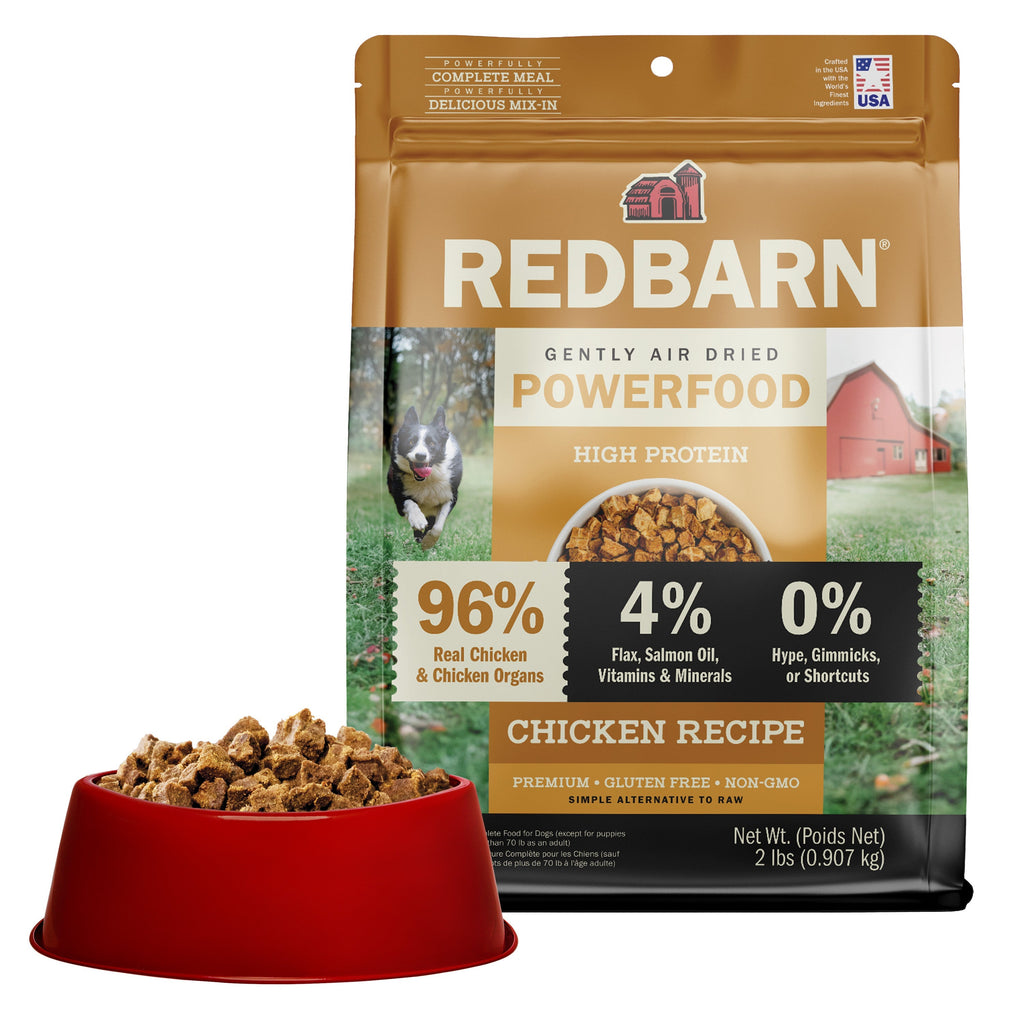 Best Air Dried Dog Food. Redbarn Powerfood High Protein Chicken Recipe dog food package with a bowl full of food in the background.