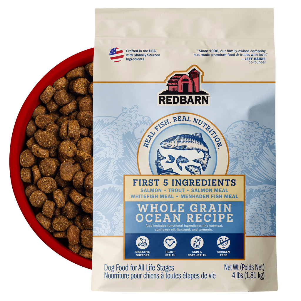 Best Fish Food for dogs. Redbarn Whole Grain Ocean recipe dog food package featuring Salmon, Trout, Salmon Meal, Ocean Fish Meal, Menhaden Fish Meal.