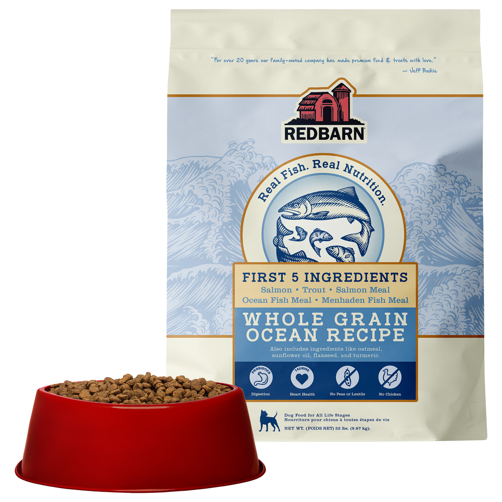 Best Fish Food for dogs. Redbarn Whole Grain Ocean recipe dog food package featuring Salmon, Trout, Salmon Meal, Ocean Fish Meal, Menhaden Fish Meal.