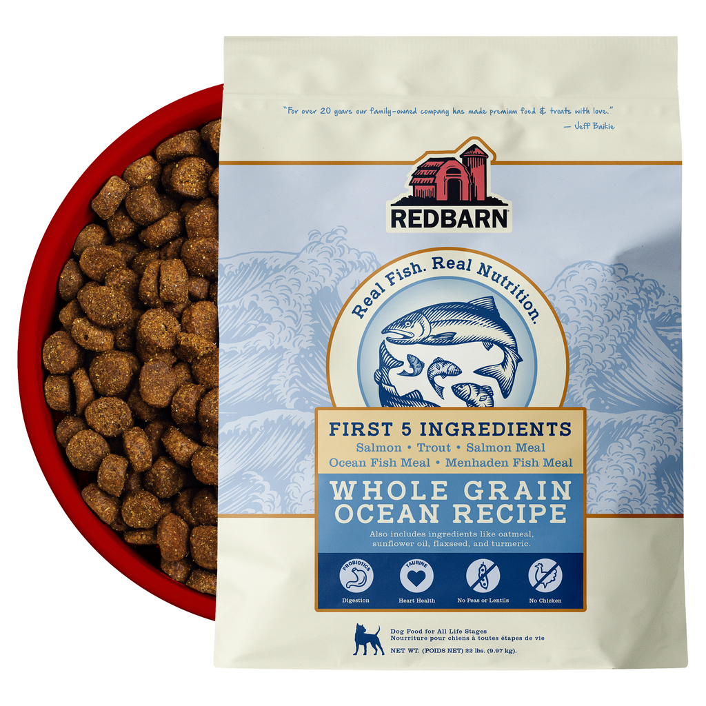 Best Fish Food for dogs. Redbarn Whole Grain Ocean recipe dog food package featuring Salmon, Trout, Salmon Meal, Ocean Fish Meal, Menhaden Fish Meal.