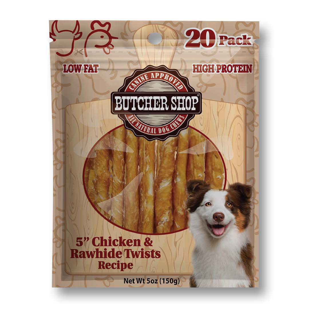 A 20-pack bag of Butcher Shop Natural Dog Chow 5-inch chicken and rawhide twists recipe dog treats. The packaging features a wood-grain pattern background, a circular clear window showing the golden-brown twisted treats inside, and a smiling brown and white dog on the lower right.