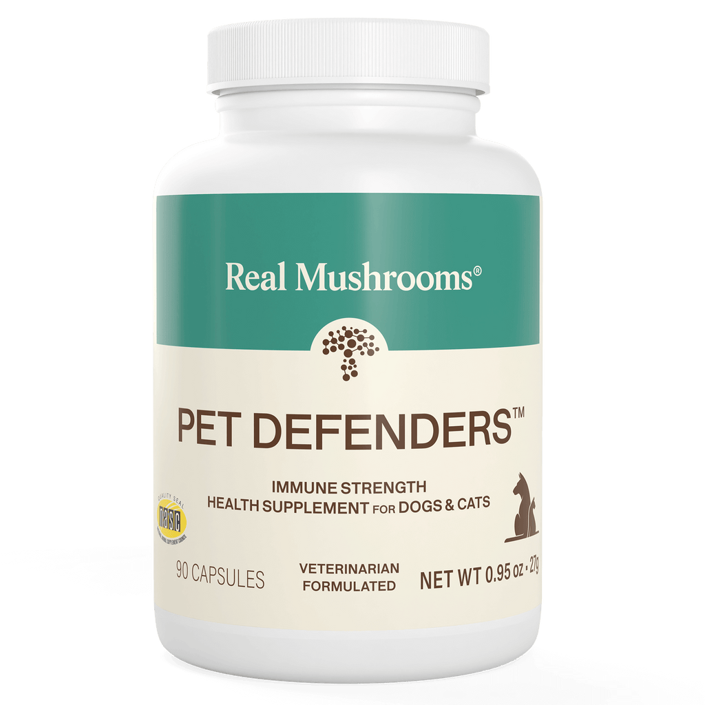 White bottle labeled "Pet Defenders™ Organic Mushroom Blend Capsules for Pets" by Real Mushrooms, an immune support supplement for dogs and cats with 90 veterinarian-formulated capsules featuring organic mushroom extracts.