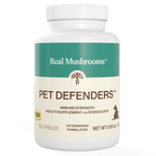White bottle labeled "Pet Defenders™ Organic Mushroom Blend Capsules for Pets" by Real Mushrooms, an immune support supplement for dogs and cats with 90 veterinarian-formulated capsules featuring organic mushroom extracts.
