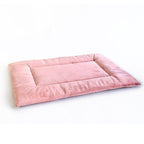 Pink PAWD Crate Pad and dog bed by KindTail featuring soft, cozy cushioning for comfortable pet rest.