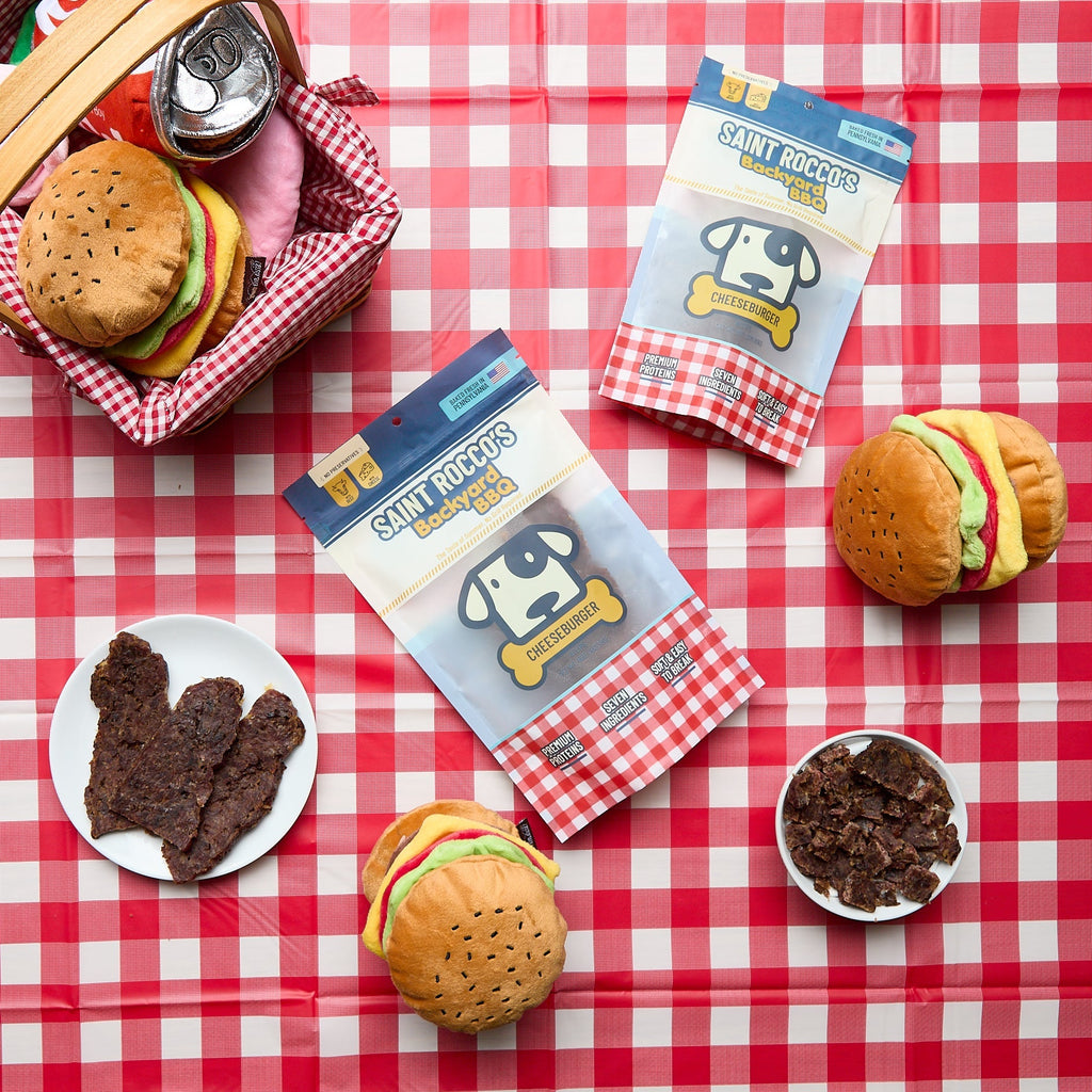 Saint Rocco's Backyard BBQ limited-edition cheeseburger on a picnic table.