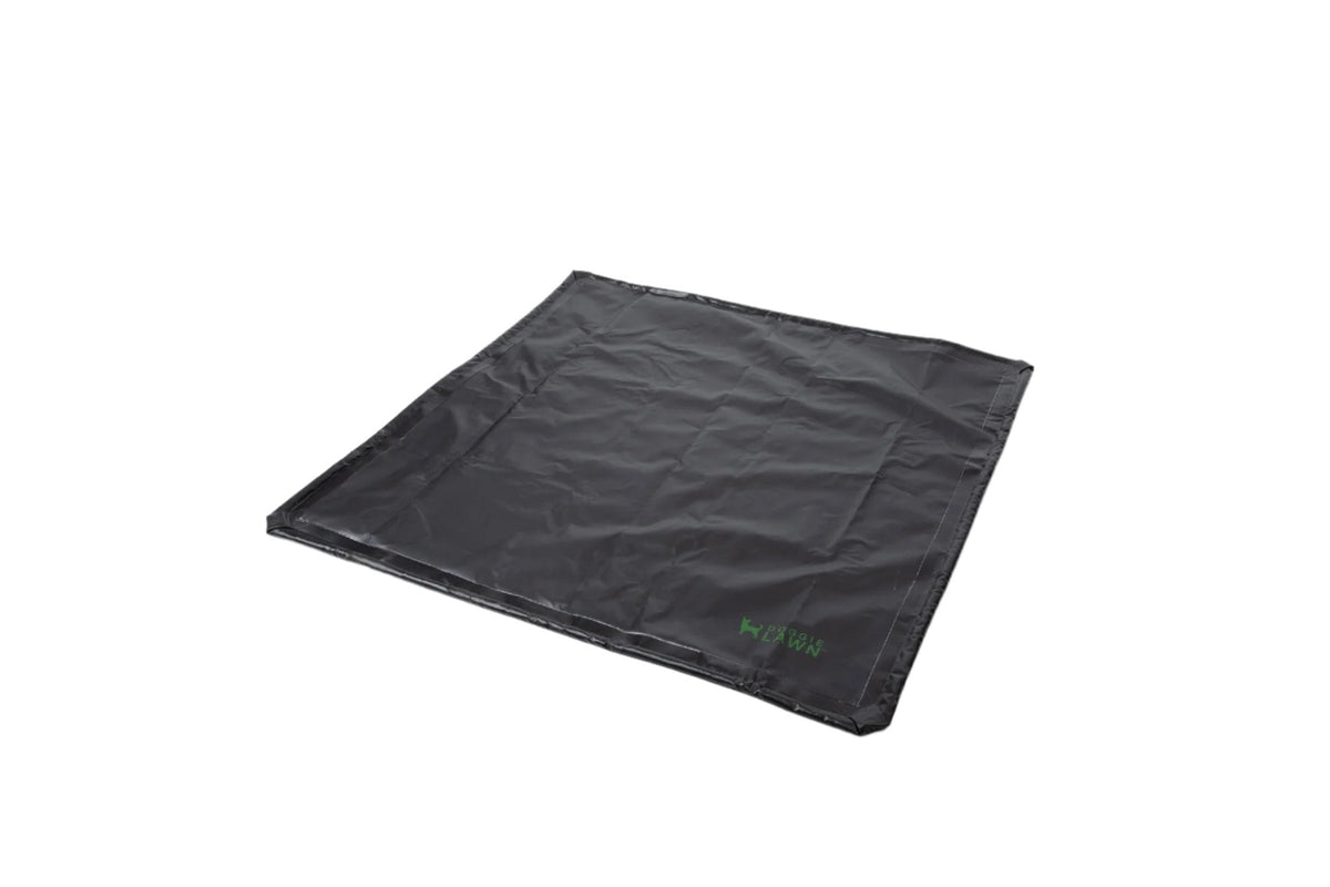 DoggieLawn double-size flexible black tray mat for grass pads, shown folded flat on a white background.