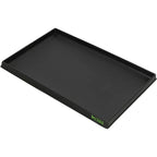 Black rectangular plastic tray with raised sides for holding an indoor dog grass pad.