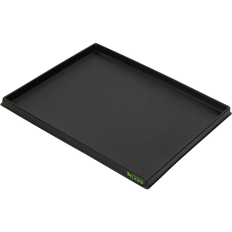 Black rectangular plastic tray with raised sides for an indoor dog grass potty pad.