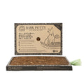 Bark Potty standard all-natural disposable dog potty with bark surface tray and branded packaging on a white background.