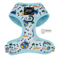 The Dog Adjustable Harness - Disney's Stitch by Sassy Woof features a light blue tropical print with islands, palm trees, waves, and Stitch on pool floats. Includes black Sassy Woof logo patch and PATENTED badge. Perfect for your puppy’s growth plan.