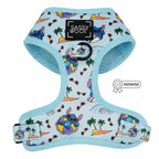 The Dog Adjustable Harness - Disney's Stitch by Sassy Woof features a light blue tropical print with islands, palm trees, waves, and Stitch on pool floats. Includes black Sassy Woof logo patch and PATENTED badge. Perfect for your puppy’s growth plan.