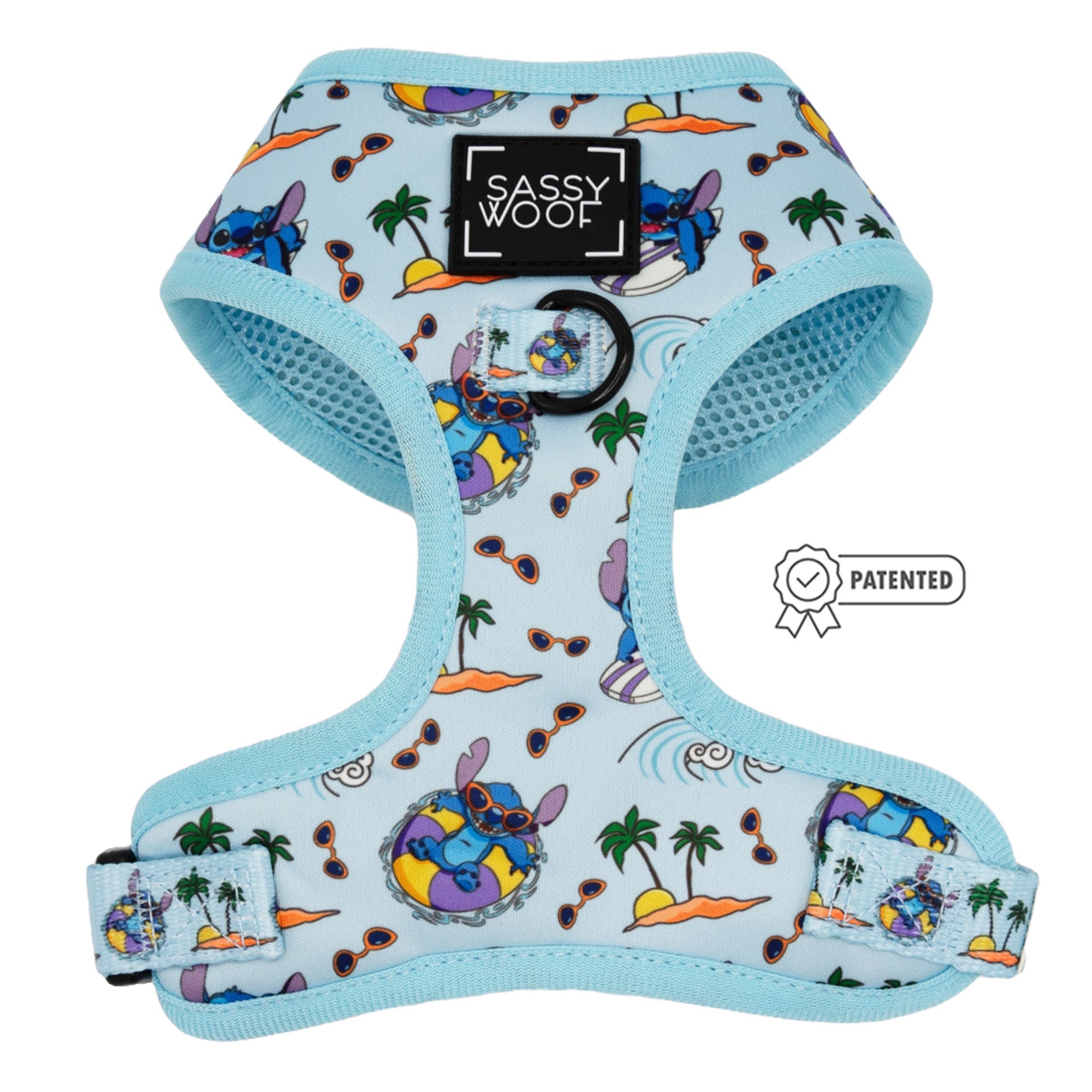 The Dog Adjustable Harness - Disney's Stitch by Sassy Woof features a light blue tropical print with islands, palm trees, waves, and Stitch on pool floats. Includes black Sassy Woof logo patch and PATENTED badge. Perfect for your puppy’s growth plan.