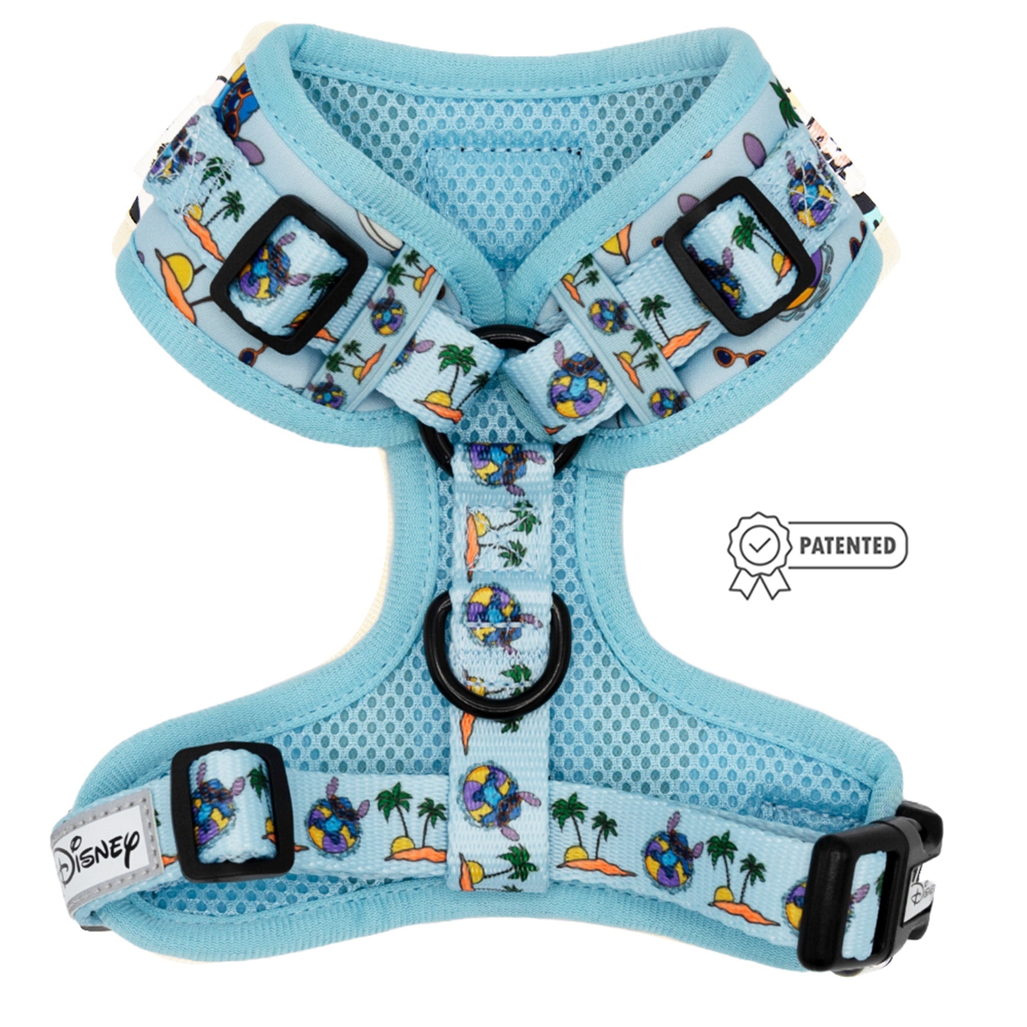 The Sassy Woof Dog Adjustable Harness - Disney's Stitch features a light blue tropical print with palm trees, surfboards, and Stitch characters. It includes black buckles, a patented badge, and Disney tag for style and comfort.