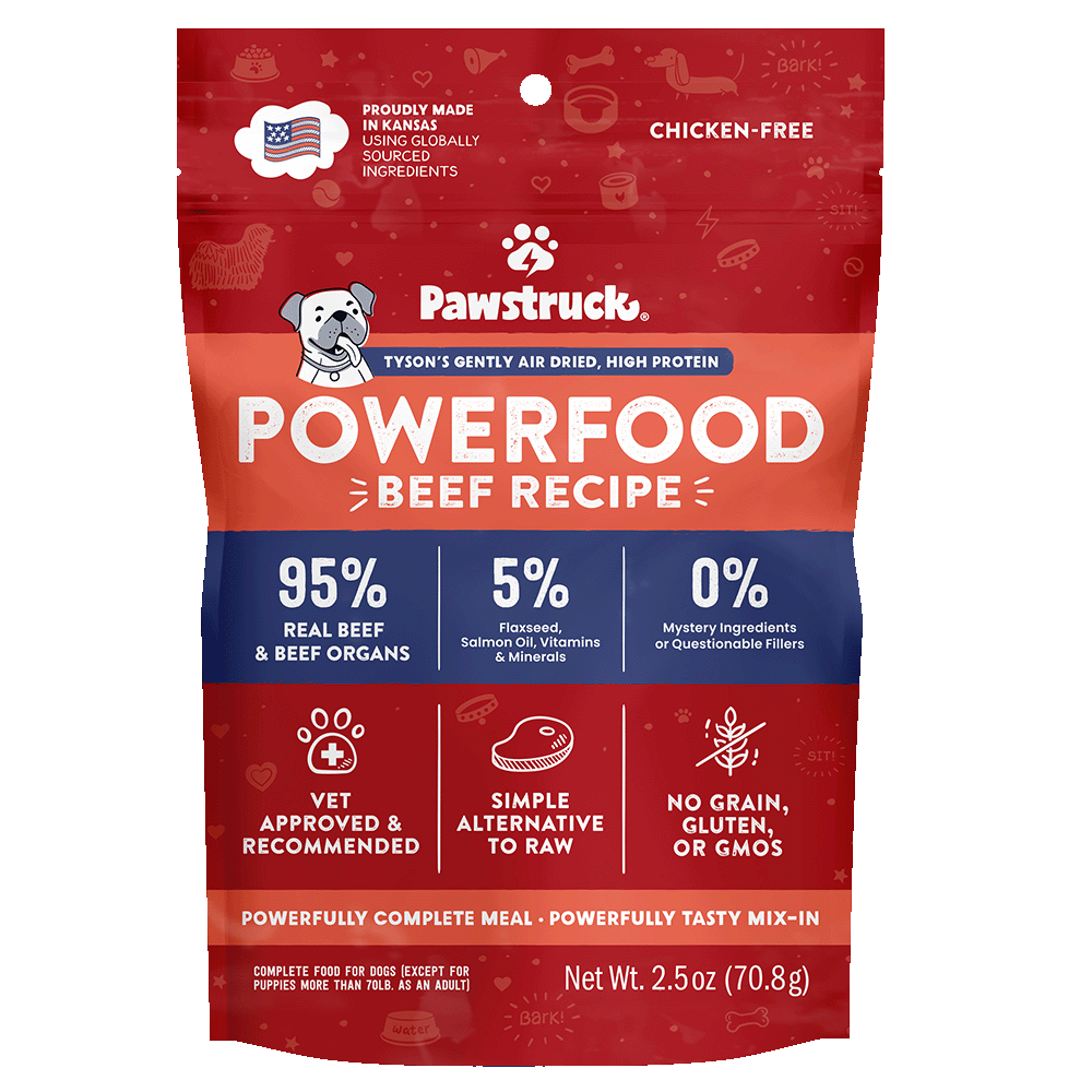 A package of Pawstruck brand air dried dog food in Beef recipe flavor. The packaging is predominantly red with an illustration of a dog and text detailing the product type and nutritional information.