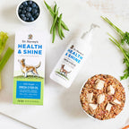 Dr. Harvey's Health & Shine Omega-3 Fish Oil box and pump bottle beside a bowl of dog food, blueberries, and green beans.