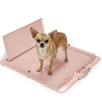 Pink Pee PAWD® dog potty training pee pad holder by KindTail, designed to secure and hold puppy pee pads in place.
