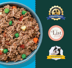 Bowl of ground meat dog food with green peas, red and orange diced vegetables, and pasta pieces.