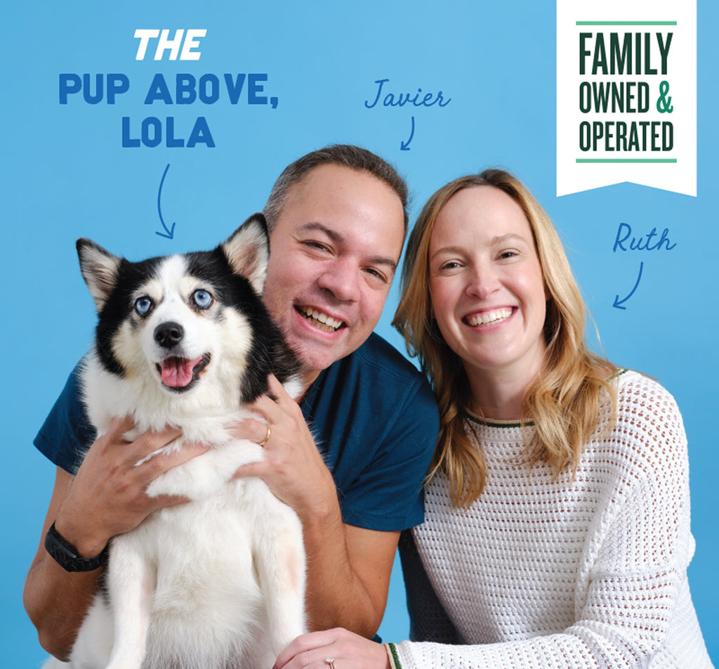 Two people and a black-and-white husky dog smiling against a blue background with text identifying them as owners of a family