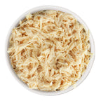 A white bowl filled with finely shredded boneless Weruva Paw Lickin' Chicken, seen from above on a white background—ideal for classic recipes or pairing with savory gravy.