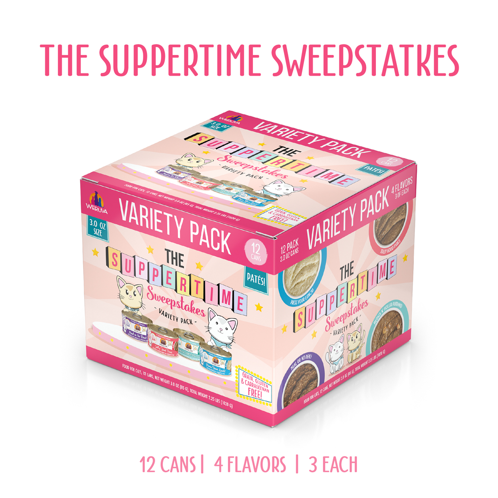 A colorful Weruva box labeled "The Suppertime Sweepstakes" sits on a white surface. It features cartoon cats, pink accents, and contains 12 cans of high-quality protein paté cat food in 4 flavors.
