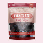 A Package of Farm to Pet beef chips dog treats on a pink background.