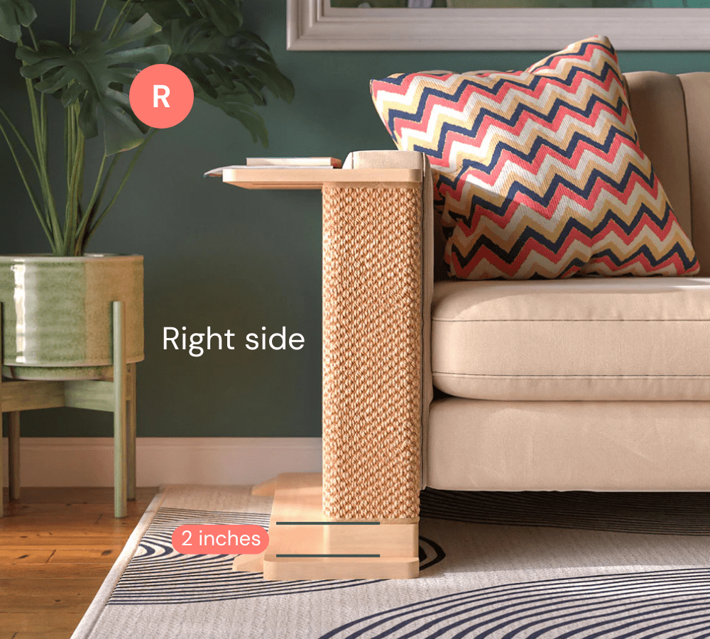 A Cat-e-Corner table placed next to a sofa, integrating a cat's scratching post with a small table, in a room with a plant and a colorful cushion.