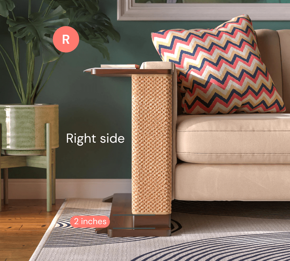 A Cat-e-Corner table placed next to a sofa, integrating a cat's scratching post with a small table, in a room with a plant and a colorful cushion.
