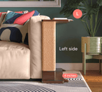 A Cat-e-Corner table placed next to a sofa, integrating a cat's scratching post with a small table, in a room with a plant and a colorful cushion.