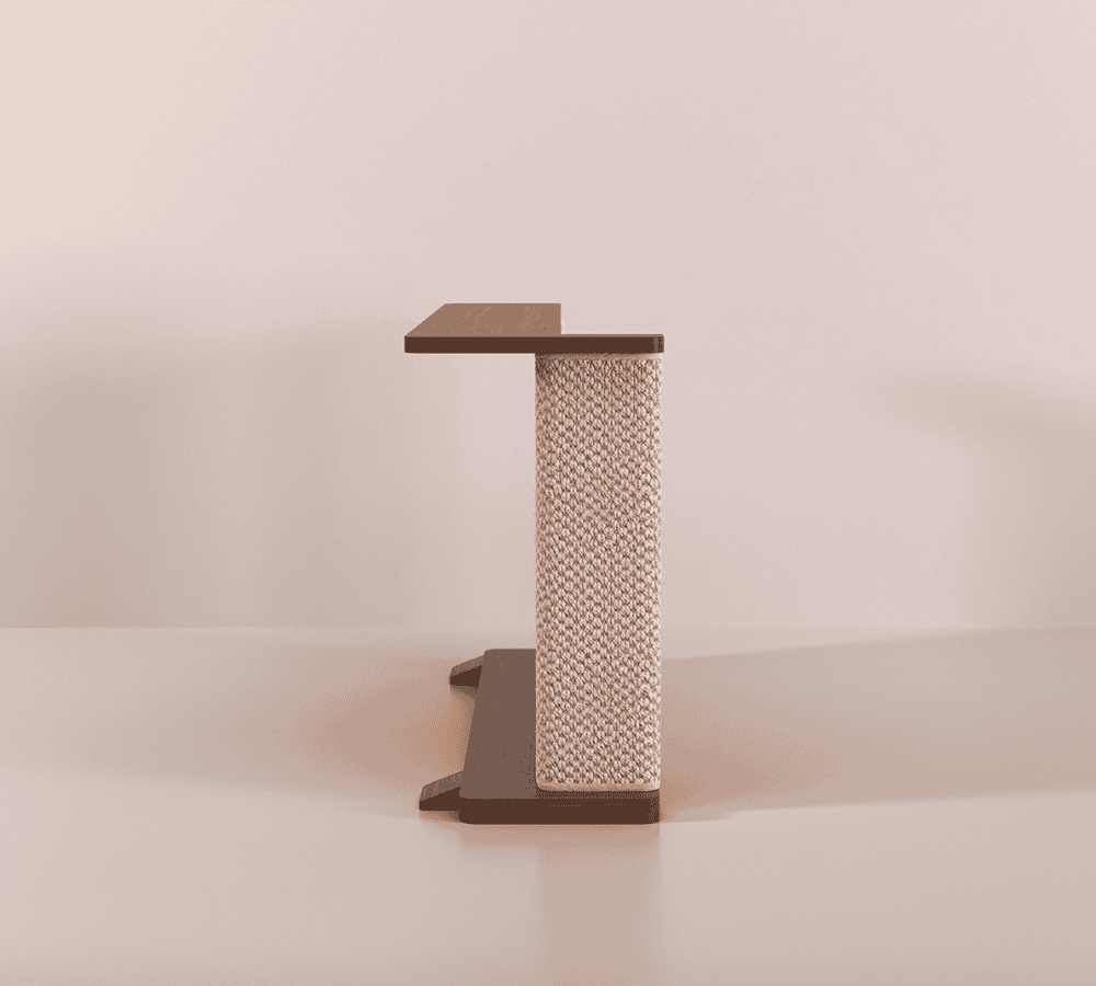 A Cat-e-Corner table placed next to a sofa, integrating a cat's scratching post with a small table, in a room with a plant and a colorful cushion.