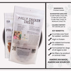 Front view of Philly Chicken Cheese dog treat pouch showcasing large product name and resealable white pouch with clear snack window on light background