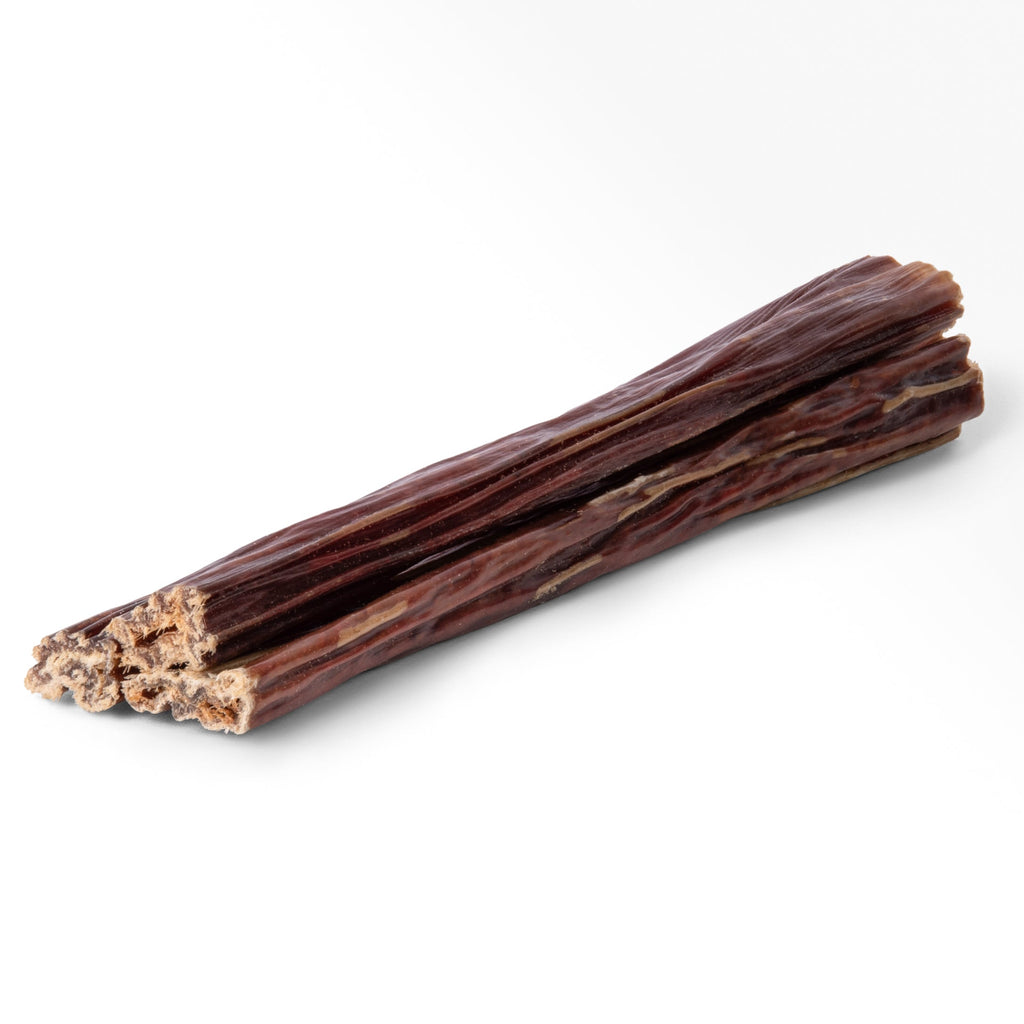 Side view of 6-inch beef gullet jerky sticks showcasing braided texture and meaty interior on white background