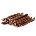 Front view of 6 inch thin bully sticks showing a pile of baked single-ingredient beef sticks on white background
